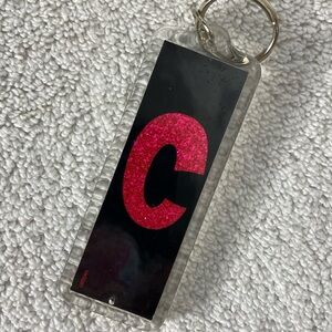 5/$35 Vintage Sparkly Pink “C” On Black Background Plastic Rectangle Keychain